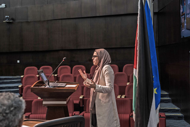 Hanan Alchahadat, the student representative of the Higher and Further Education Opportunities and Perspectives for Syrians project, speaks at the Petra University on Monday (Photo courtesy of the Madad Fund)