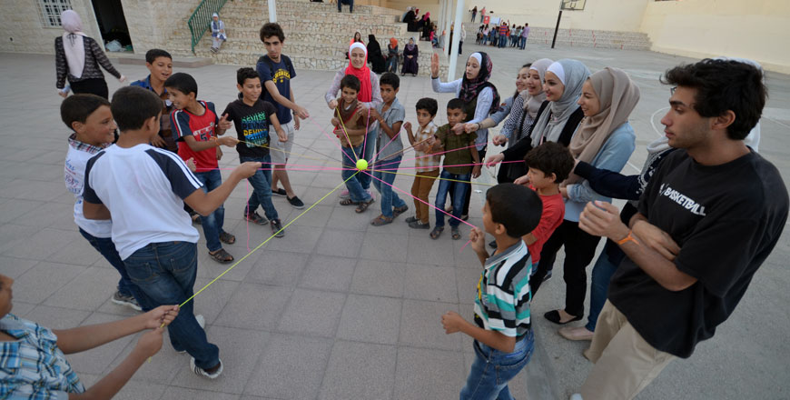 Children from the Jerash Refugee Camp play with volunteers during an open day organised by the Basmitak Ha Taalem initiative at Amman’s Modern Montessori School earlier this week (Photo by Muath Freij)