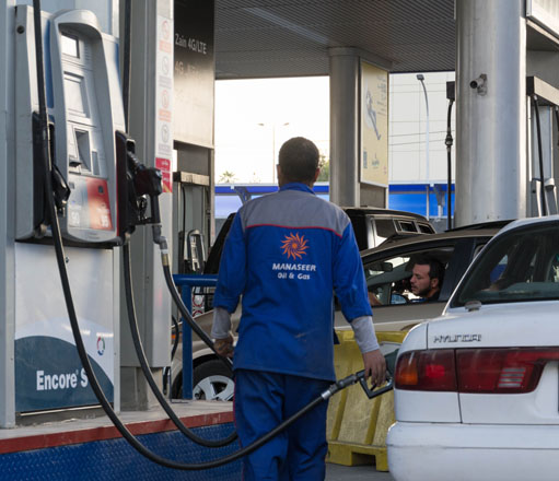 The price of one litre of unleaded 90-octane gasoline will drop from JD0.62 to JD0.56 under a government decision announced Monday (Photo by Amjad Ghsoun)