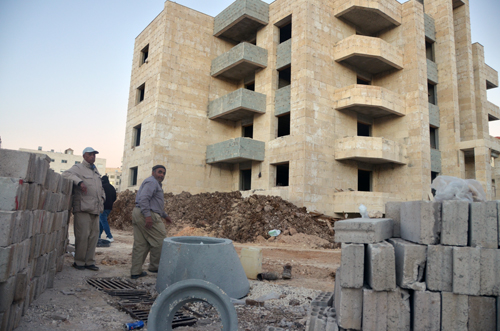Workers are seen at a construction site in Amman recently (Photo by Muath Freij)