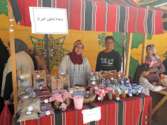   A woman selling her homemade products at the ‘Jerash Mouneh Exhibition’, which opened on Wednesday in Jerash Archaeological Park (Photo by Ahmed Bani Mustafa)