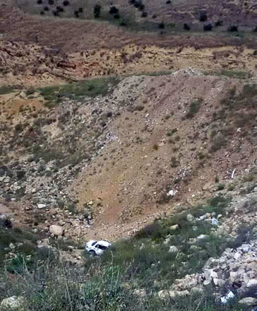 A car that skidded off a steep hill near the Karak bridge, on Monday (Photo courtesy of Khalil Farrayeh)