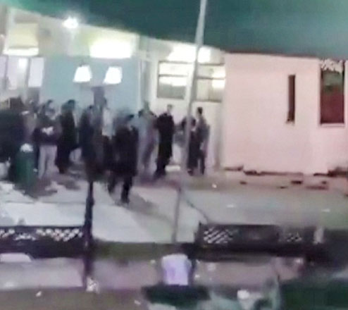 This image grab from a UGC video taken on July 16, 2024 shows shows people fleeing the scene of a shooting at the Imam Ali Mosque in the Al-Wadi Al-Kabir area in the east of Oman's capital Muscat (AFP Photo)