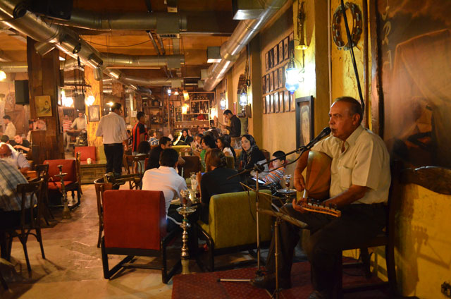 After breaking the daylong fast, Jordanians in Ramadan tend to spend their evenings at cafés and 'tents', socialising, watching football matches or listening to live music (File photo)