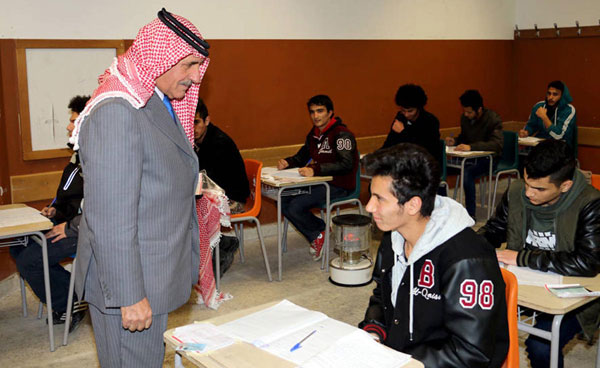 Education Minister Mohammad Thneibat speaks to Tawjihi students at an examination hall on Sunday (Petra photo)