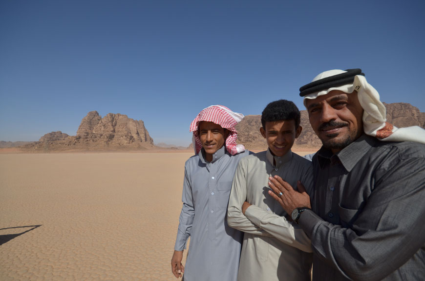 Hassan Maraaiah (right), Jacir Eid (centre) and Hussein Suweilheen pose for a photo in one of the locations where ‘Theeb’ was filmed in Wadi Rum, some 328km south of Amman, recently (Photo by Muath Freij)