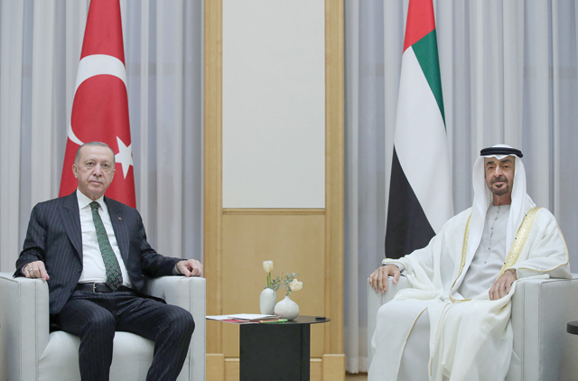 This handout photo released on Monday by the Turkish Presidential Office shows Turkish President Recep Tayyip Erdogan meeting with Crown Prince of Abu Dhabi Sheikh Mohammed Bin Zayed Al Nahyan during an official ceremony in Abu Dhabi (AFP photo)