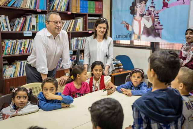 UNICEF Regional Director Geert Cappelare and UNICEF Jordan Deputy Representative Ettie Higgins interact with children at a Makani Centre in East Amman (Photo courtesy of UNICEF)