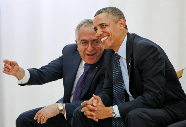 Then US president Barack Obama (right) watches a cultural event alongside then Palestinian prime minister Salam Fayyad at Al Bireh Youth Centre in Ramallah, March 21, 2013 (Reuters photo)