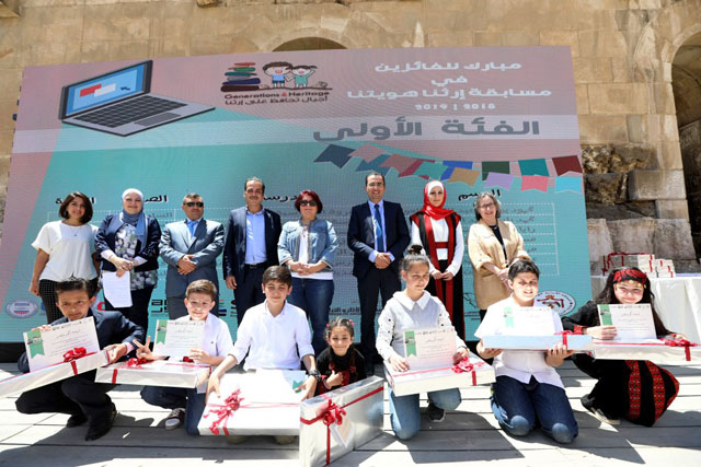 Winners of the ‘Our Heritage, Our Identity’ student video competition pose for a group picture during the ceremony on Saturday at the historic Odeon Theatre in Amman (Photo courtesy of USAID)