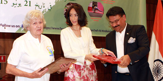 HRH Princess Rym Ali, flanked by yoga instructor Samira Dajani and Indian Ambassador Anil Trigunayat, at a celebration marking the first International Day of Yoga on Sunday (Photo by Hassan Tamimi)