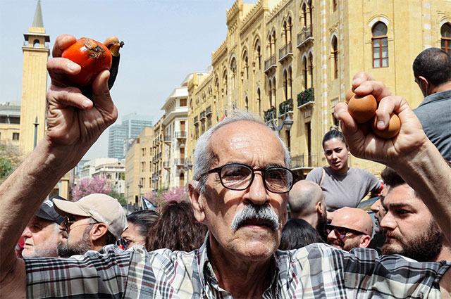 In this file photo taken on April 26, Lebanese protesters rally against the draft law on capital control, outside the parliament building in downtown Beirut (AFP photo)
