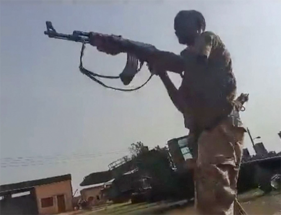A grab from a UGC video posted on the X platform (formerly Twitter) on August 22, reportedly shows members of the Sudanese army firing at Rapid Support Forces fighters in what they say is Al Shajara military base in Khartoum (AFP photo)