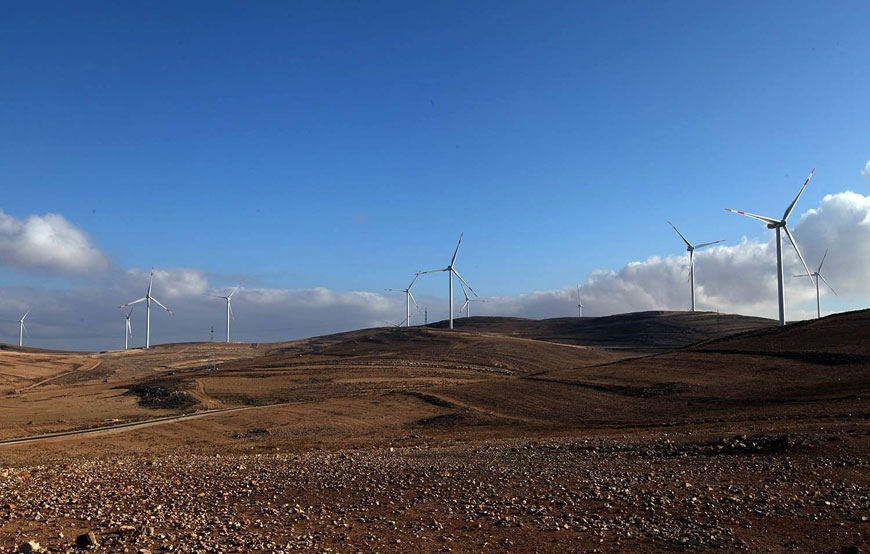 Wind turbines are seen at the Tafileh wind farm, a joint venture between Inframed, EPGE and the United Arab Emirates' Masdar company, which on Wednesday announced a project to develop a 200 megawatt photovoltaic solar plant for the Energy Ministry (Photo courtesy of Masdar)