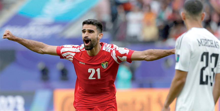Jordan's midfielder #21 Nizar Al Rashdan celebrates scoring his team's third goal during the Qatar 2023 AFC Asian Cup football match between Iraq and Jordan at Khalifa International Stadium in Doha on Monday (AFP photo)