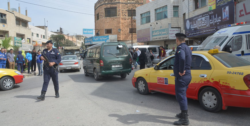 Security personnel monitor a street in Irbid, some 80km north of Amman, on Wednesday (Photo by Muath Freij)