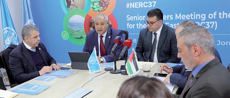 Minister of Agriculture Khalid Hneifat (right) says during the 37th session of the FAO Regional Conference for the Near East that Jordan has borne the repercussions of regional and global crises over the past 100 years (Petra photo)
