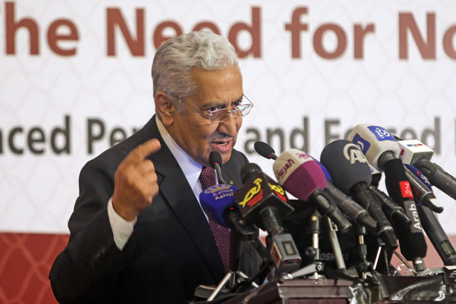 Prime Minister Abdullah Ensour delivers a speech at a conference on refugees at Yarmouk University in Irbid, some 80km north of Amman, on Tuesday (Photo by Nader Daoud)
