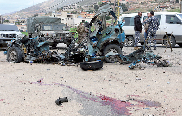Lebanese soldiers cordon off the site of an Israeli drone attack targeting a vehicle in the town of Souairi, in western Bekaa Valley 'in central Lebanon' on Sunday (AFP photo)