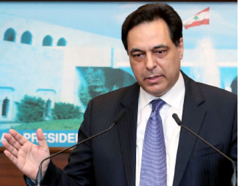 This file handout photo provided by the Lebanese photo agency Dalati and Nohra on Thursday, shows Lebanon's caretaker prime minister Hassan Diab speaking to reporters at the presidential palace in Baabda, east of the capital Beirut (AFP photo)