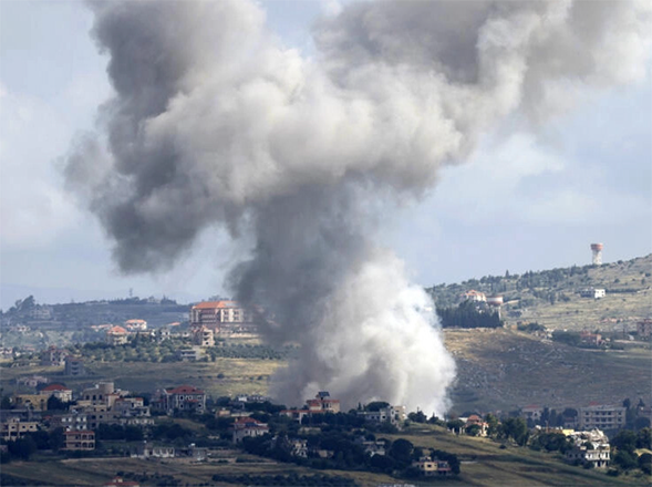 Seen from northern Israel, smoke billows above the Lebanese village of Mays Al Jabal during Israeli bombardment (AFP photo)