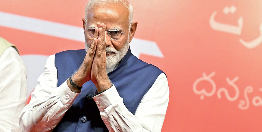 India's Prime Minister Narendra Modi gestures at the Bharatiya Janata Party headquarters to celebrate the party's win in country's general election, in New Delhi on Tuesday (AFP photo)