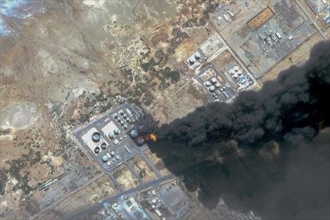 This handout satellite photo obtained from Planet Labs PBC and dated May 6, 2025, shows smoke billowing from a fuel storage depot after a strike on Port Sudan (AFP photo)