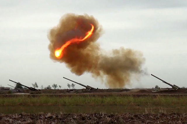 An image grab taken from a video made available on the official website of the Azerbaijani Defence Ministry on Monday, allegedly shows Azeri artillery strike towards the positions of Armenian separatists in the breakaway region of Nagorno-Karabakh (AFP photo)
