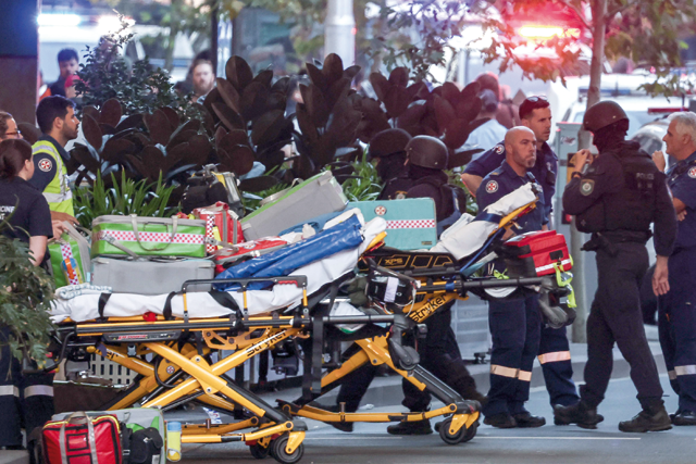 Police enter the Westfield Bondi Junction shopping mall after a stabbing incident in Sydney on Saturday (AFP photo)