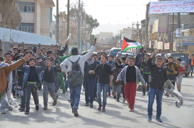 Children in Baqaa refugee camp protest against the US decision on Jerusalem in the camp on Tuesday (Photo by Muath Freij)