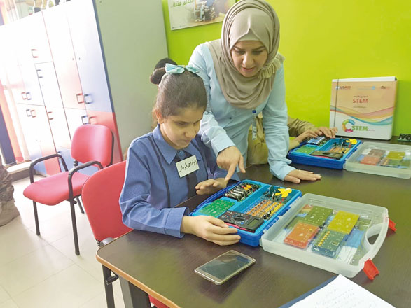 Eleven-year-old Zahra Abu Dalou, a visually impaired student at the Royal Academy for the Blind, spends most of her day at the Science, Technology, Engineering and Math Lab, trying to invent devices that would ease her life (Photo by Rana Husseini)