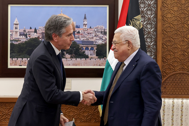 Palestinian President Mahmoud Abbas and US Secretary of State Antony Blinken shake hands following their meeting in Ramallah in the occupied West Bank, on Tuesday (AFP photo)