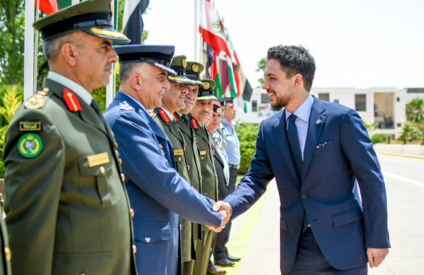 HRH Crown Prince Hussein is greeted by top brass as he arrives to attend the graduation ceremony of anti-terrorism courses involving officers on Thursday (Photo courtesy of Royal Court)