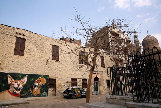 A graffiti, painted on the wall of a house located inside the 15th-century complex built by Mameluk Sultan Al Ashraf Qaitbey, is photographed in Cairo’s City of the Dead, Egypt, on Monday (Reuters photo)