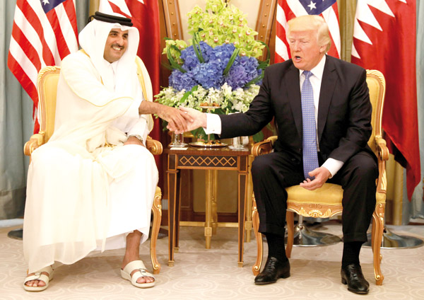 Qatar’s Emir Sheikh Tamim Bin Hamad Al Thani meets with US President Donald Trump in Riyadh, Saudi Arabia, on Sunday (Reuters photo)