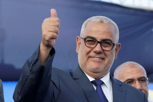 Moroccan Prime Minister Abdelilah Benkirane, secretary general of the Justice and Development Party, waves during a party meeting in Rabat, Morocco, on Thursday (Reuters photo)