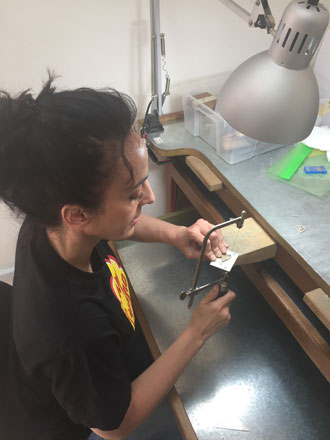 Jordanian designer Dana Rousan is seen creating jewelry pieces which she describes as 'mixing her Levantine heritage' with minimalism (Photo courtesy of Dana Rousan)