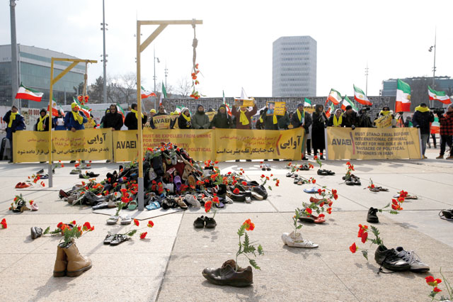 People demonstrate against the speech of Seyyed Ali Reza Avai, minister of justice of Iran, at the Human Rights Council, in front of the United Nations in Geneva, Switzerland, on Tuesday (Reuters photo)