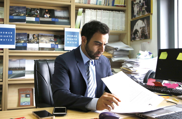Human Rights Watch's Israel and Palestine Director Omar Shakir, a US citizen, sits at his office in the West Bank city of Ramallah on Wednesday (AFP photo)