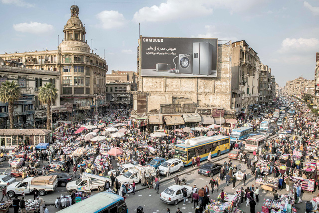 This photo taken on February 22 shows a view of vehicles stuck in a traffic jam amidst street vendors and pedlars in the central Attaba district of Egypt’s capital Cairo (AFP photo)