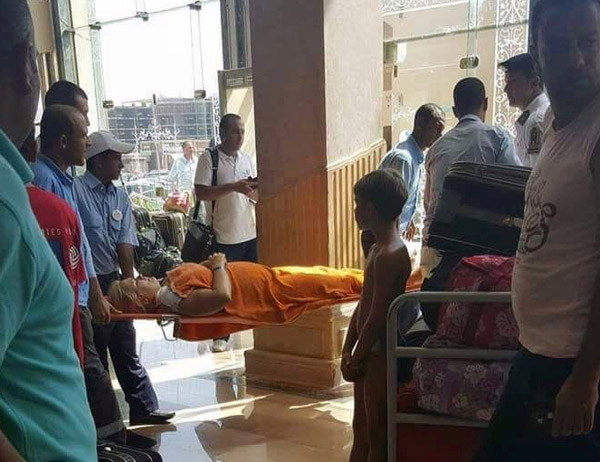 Medics rush an injured tourist at the Zahabia hotel resort, after an Egyptian man stabbed two German tourists to death and wounded four others in Hurghada, south of the capital Cairo, Egypt, on Friday (Reuters photo)
