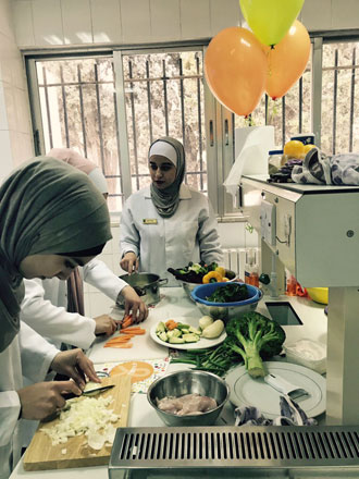 University of Jordan's nutrition majors take part in 'healthy cooking' competition, organised recently by King Hussein Cancer Centre (Photo by Dana Eyad)