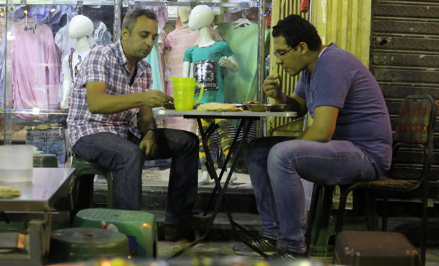 People have their pre-dawn Suhoor meal before fasting another day during the Muslim holy month of Ramadan in Cairo, Egypt, on May 31 (Reuters photo)