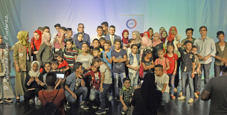 Young graduates pose for a photo with French Ambassador to Jordan David Bertolotti in Amman on Saturday (Photo courtesy of French embassy)