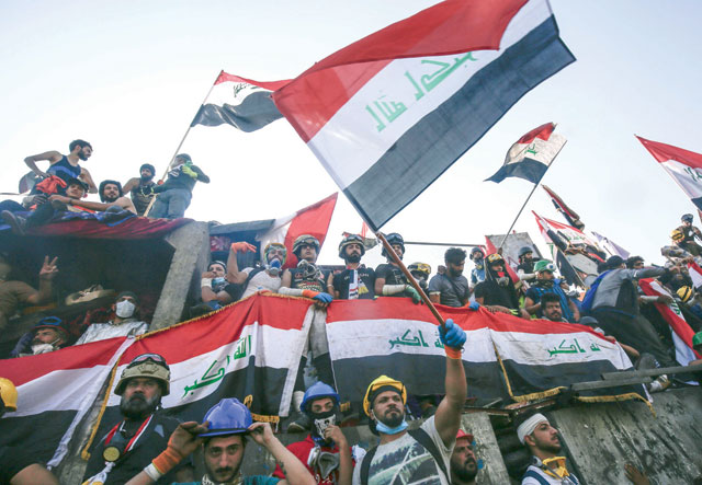 Iraqi protesters gather on Al Jumhuriya bridge which leads to the high-security Green Zone, during ongoing anti-government demonstrations in the capital Baghdad, on Saturday (AFP photo)