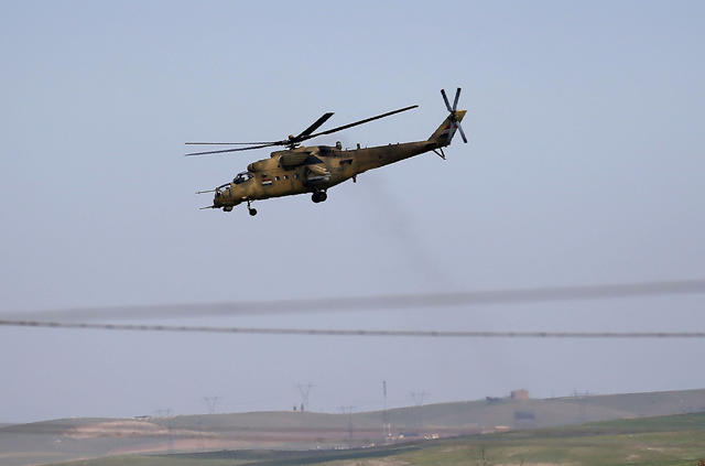 An Iraqi army helicopter is seen flying over the outskirts of western Mosul on Thursday, during an offensive to retake the city from the Daesh militants (AFP photo)
