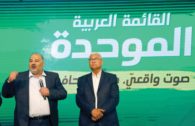 Mansour Abbas (left), leader of the United Arab List, speaks to supporters from his campaign headquarters in the northern Israeli city of Tamra on Tuesday, before polling stations close during the fourth Israeli national election in two years (AFP photo)