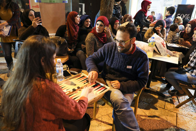 A man and woman compete in a backgammon championship organised by Double Yerushalmi, a group trying to build closer ties between Arabs and Jews through cultural activities, in Jerusalem on Monday (Reuters photo)
