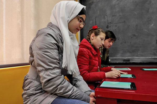 In this undated photo, youth participate in blended courses at one of the learning hubs recently launched by UNHCR, Google.org and Learning Equality (Photo courtesy UNHCR)