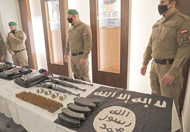 Lebanese Internal Security Forces show weapons the ministry of interior said were seized from Daesh, which was planning attacks on targets in Beirut's southern subrubs, during a press conference in the Lebanese capital on Wednesday (AFP photo)
